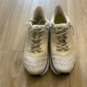 White and Yellow Running Shoes